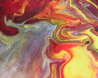 Colorful abstract pattern with swirling acrylic paints in vibrant shades. 4k abstract wallpaper