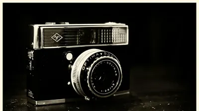 Close-up of a vintage Agfa Optima camera with a classic lens. Perfect for retro- 4k aesthetic wallpaper