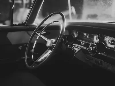 Elegant black and white interior of a classic vintage car showcasing timeless de 4k aesthetic wallpaper