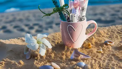 Music notes beach scene rolled sheet music 4k aesthetic wallpaper