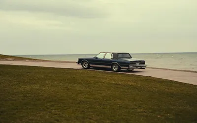 Vintage Chevrolet car parked by the scenic Toronto waterfront. 4k aesthetic wallpaper
