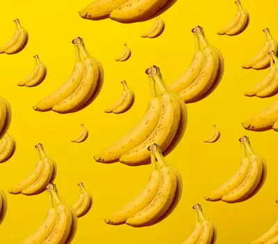 A creative and vibrant pattern of bananas against a bright yellow background, id 4k anime wallpaper