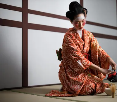 A woman performing a Japanese tea ceremony while wearing a traditional kimono. 4k anime wallpaper