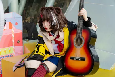Anime cosplayer with guitar in colorful costume outdoors, blending music and Jap 4k anime wallpaper