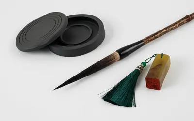 Close-up of traditional Asian calligraphy tools including ink stone, brush, and  4k anime wallpaper