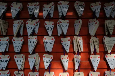 Japanese fox-faced ema plaques display at shrine in Tokyo, Japan. 4k anime wallpaper