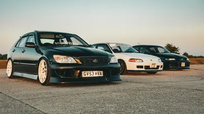 A line-up of custom sports cars including Lexus and Honda models on a road at su 4k cars wallpaper