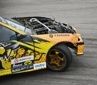 A vibrant stock car with visible engine damage after an auto racing crash, showc 4k cars wallpaper