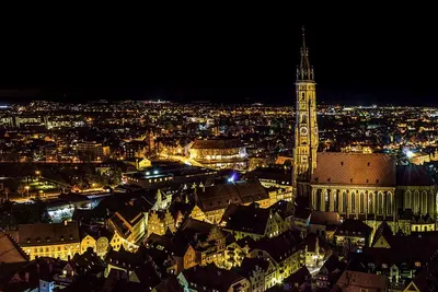 City buildings illuminated 4k city wallpaper