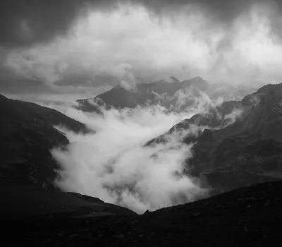 Mountains fog clouds 4k dark wallpaper
