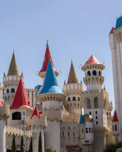 Vibrant castle-themed Excalibur Hotel in Las Vegas under a clear blue sky. 4k fantasy wallpaper