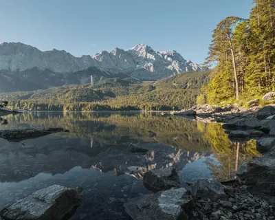 Scenic view of Zugspitze and Eibsee with reflection amid nature. 4k lake wallpaper