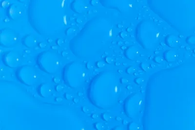 Closeup top view of dark blue wet blurred background with still shiny abstract t 4k minimal wallpaper