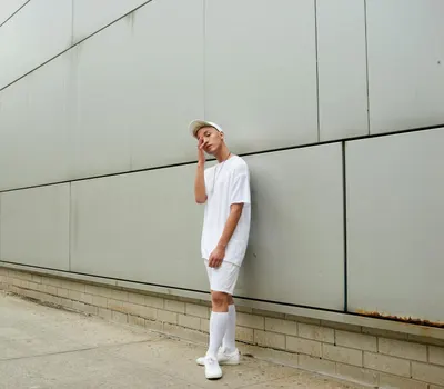 Contemporary minimalist streetwear fashion shot in urban New York setting. 4k minimal wallpaper