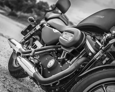 Black and white image highlighting a detailed view of a Harley Davidson motorcyc 4k motorcycle wallpaper