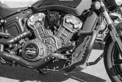 Black and white photo highlighting the detailed engine of a classic motorbike wi 4k motorcycle wallpaper
