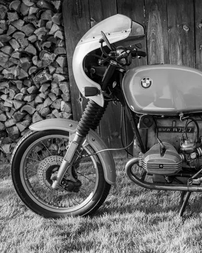 Classic BMW motorcycle in a monochromatic style against wooden background. 4k motorcycle wallpaper