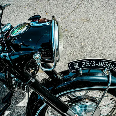 Close-up of a vintage motorcycle headlight and fender with plate detailing. 4k motorcycle wallpaper