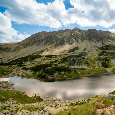 Explore the pristine beauty of an alpine lake surrounded by stunning mountain sc 4k mountain wallpaper