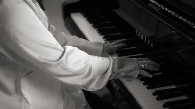 A close-up shot of hands playing the piano, highlighting musical elegance. 4k music wallpaper