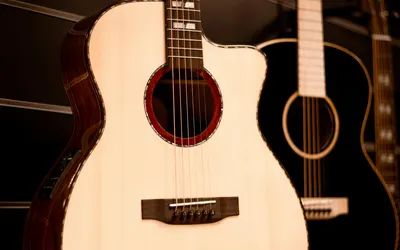 Detailed view of acoustic guitars hanging in a music store reflecting musical cr 4k music wallpaper