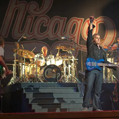 Energetic live concert show featuring musicians performing with drums, guitar, a 4k music wallpaper