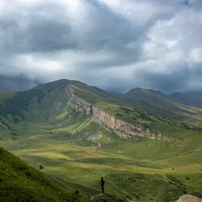 Breathtaking view of rolling green hills and cloudy sky in Qusar, Azerbaijan. 4k nature wallpaper