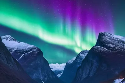 Northern Lights Over Snowy Peaks phone nature wallpaper