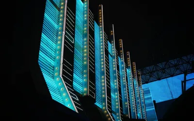 Vibrant neon lights illuminate modern architecture in the heart of Las Vegas at  4k neon wallpaper