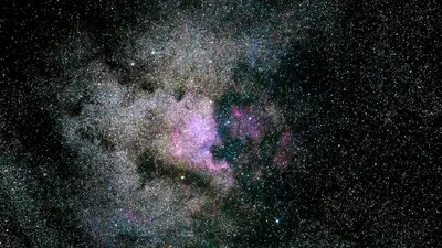 Captivating image of a vibrant nebula filled with stars in the expansive univers 4k space wallpaper