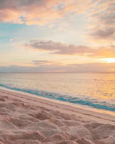 Beautiful sunset at a Hawaiian beach, capturing golden sands and vibrant skies. 4k sunset wallpaper