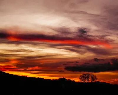 Stunning sunset with dramatic clouds over Plüderhausen, Germany, showcasing vibr 4k sunset wallpaper
